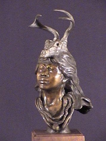 Bronze bust with antler headdress sculpture.